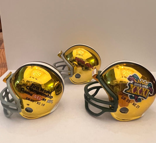 Riddell Pocket Pro and Throwback Pocket Pro mini helmets ( NFL ): Green Bay Packers Super Bowl I, II, and XXXI Championship Chrome Pocket Pro Helmets (3 Helmets)
