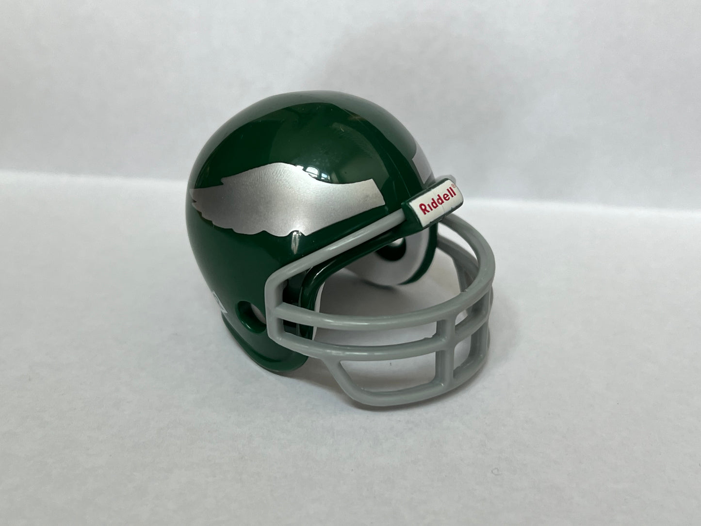 Philadelphia Eagles Riddell NFL Pocket Pro Helmet 1955-1968 Throwback (Green Helmet, Silver Wings with Grey Mask) from series 1  WESTBROOKSPORTSCARDS   